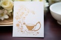 closeup of an elegant tea party invitation with teapot motif Royalty Free Stock Photo