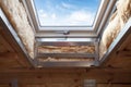 Closeup of element in plastic mansard or skylight window on a asphalt shingle roof.