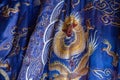 Closeup of embroidered fabric costume with dragons, Temple of Literature, Hanoi, Vietnam.