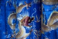 Closeup of embroidered fabric costume with dragons, Temple of Literature, Hanoi, Vietnam.