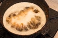 Closeup of empanada deep fried in a pot Royalty Free Stock Photo
