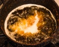 Closeup of empanada deep fried in a pot Royalty Free Stock Photo