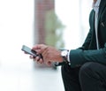 Closeup. employee typing SMS on the smartphone