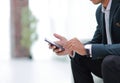 Closeup. employee typing SMS on the smartphone