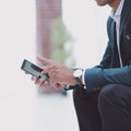 Closeup. employee typing SMS on the smartphone