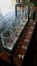 Empty glasses with different sorts of craft beer on wooden bar. Royalty Free Stock Photo