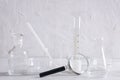 Closeup of empty medical glassware, magrifier.Concept of researching and laboratory testing