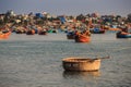 Closeup Empty Round Fishing Boat with Paddle in Sea in Vietnam