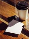 Closeup Empty White Business Card.Mockup.Mobile Phone High Textured Wood Table Take Away Coffee Cup.Work Modern Office