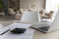 Closeup empty working table with computer and paper utility bills. Royalty Free Stock Photo