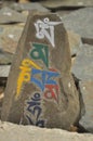 Closeup of engraved stone with Buddhist mantra Om Mani Padme Hum in Zanskar Valley, Ladakh, INDIA Royalty Free Stock Photo