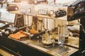 Closeup espresso machine making fresh coffee at coffee shop vintage color tone