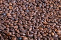 Closeup espresso roasted coffee beans with sheen dense oily surface crema potential dramatic cafe lighting premium smallbatch Royalty Free Stock Photo