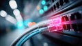 Closeup of Ethernet cables plugged into network switch with glowing LED lights, data center connectivity and Royalty Free Stock Photo