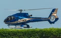 Closeup of the Eurocopter EC130 B4 landing on a grass in Dubai Royalty Free Stock Photo