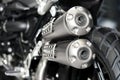 Closeup of exhaust or intake of racing motorcycle. Low angle photograph of motorcycle.