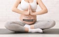 Expectant woman relaxing, practicing yoga or meditation, collage with progress loading bar on pregnant belly