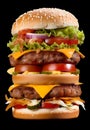 Closeup of extra tall hamburger with delicious ingredients Royalty Free Stock Photo