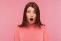 Closeup extremely shocked bemused brunette woman looking at camera with big eyes and widely opened mouth, deeply impressed