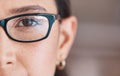 Closeup of the eye of a woman wearing glasses. The eye of a woman going for an optometry visit. Portrait of a woman Royalty Free Stock Photo