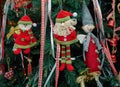 Closeup fabric decorative items hung up Christmas tree