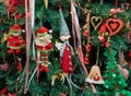 Closeup fabric decorative items hung up Christmas tree