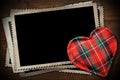 Stack of old vintage photo frames and a fabric heart shape Royalty Free Stock Photo