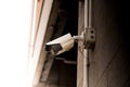 Closeup facade video surveillance camera monitoring security Royalty Free Stock Photo