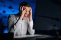 Closeup face of angry male programmer working late at night and looking at computer while screaming. Furious man working Royalty Free Stock Photo