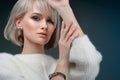 Closeup face of beautiful woman with smoky eyes make-up and light lipstick. Portrait of an attractive girl in the studio