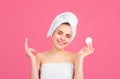 Closeup face of beautiful young smiling woman with bath towel on head. Beautiful woman face isolated on studio. Natural Royalty Free Stock Photo