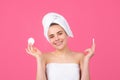 Closeup face of beautiful young smiling woman with bath towel on head. Beautiful woman face isolated on studio. Natural Royalty Free Stock Photo