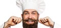 Closeup face of a cook in a hat. Funny chef with beard cook. Portrait of a happy chef cook. Bearded chef, cooks or baker Royalty Free Stock Photo