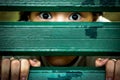 Closeup of face and eyes of sick girl,asian little child sneak peek,peeping spying eyes,suspiciously young woman feeling afraid Royalty Free Stock Photo