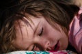 Closeup face of kid lying in bed and sleeping. Child sleep quietly calmly on bed at home. Adorable cute toddler or baby Royalty Free Stock Photo