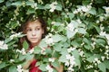 Closeup face of little girl looks out from