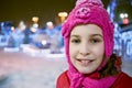 Closeup face of little girl in winter knitted hat