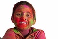 Closeup face young boy playing Holi smiling colors Royalty Free Stock Photo