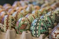 Closeup of factory-made decorated wooden, Easter egg. Concept Eas