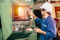 Factory worker man operate the machine, high skill labor work industry with safety clothes Royalty Free Stock Photo