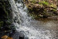 Closeup of falling and splashing streams of water, Ivande waterfall, Latvia Royalty Free Stock Photo