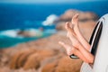 Closeup of family feet showing from car window background beautiful landscape Royalty Free Stock Photo