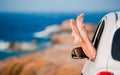 Closeup of family feet showing from car window background beautiful landscape Royalty Free Stock Photo