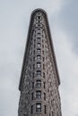 Closeup of the famous Flatiron Building in New York, the US against a blue sky