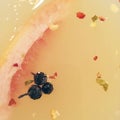 Closeup of fancy drink in martini glass with peppercorns