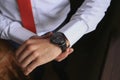 closeup fashion image of luxury watch on wrist of man. body detail of a business man. Royalty Free Stock Photo