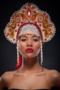 Closeup fashionable portrait of a beautiful african american woman with the richly decorated kokoshnik on her head. Russian style