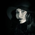 Closeup fashionable portrait of beautiful, pretty girl in black hat