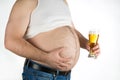 Closeup fat belly with beer isolated on white background Royalty Free Stock Photo