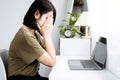 Fatigued and Stressed Asian Woman Resting from Multitasking in Front of the Computer Royalty Free Stock Photo